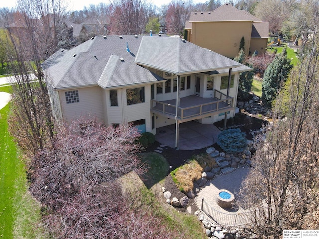 19252 Shirley St, Omaha, NE 68130 - back of property with roof with shingles, a patio area, and a deck