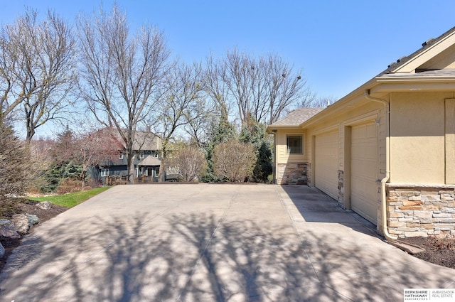 19252 Shirley St, Omaha, NE 68130 - view of yard featuring driveway and an attached garage