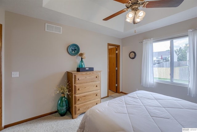 16117 Cottonwood St, Omaha, NE 68136 - bedroom with light carpet, baseboards, a ceiling fan, and a tray ceiling