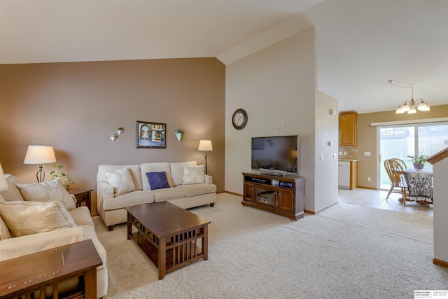 16117 Cottonwood St, Omaha, NE 68136 - living area with a chandelier, baseboards, light carpet, and high vaulted ceiling
