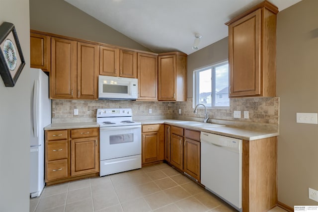 16117 Cottonwood St, Omaha, NE 68136 - kitchen featuring white appliances, a sink, vaulted ceiling, brown cabinets, and light countertops