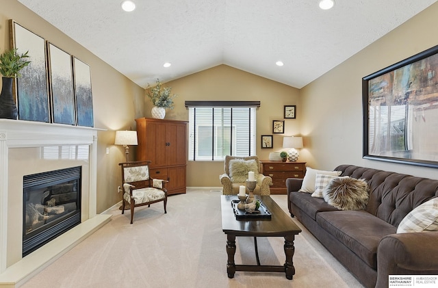 5818 S 159th St, Omaha, NE 68135 - living area with light carpet, vaulted ceiling, a textured ceiling, a glass covered fireplace, and baseboards