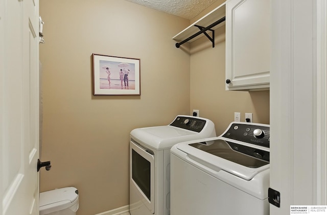5818 S 159th St, Omaha, NE 68135 - laundry room featuring independent washer and dryer, cabinet space, a textured ceiling, and baseboards