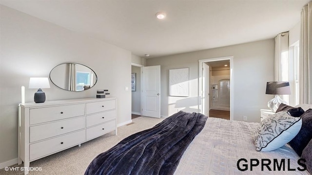 16401 Davidson St, Bennington, NE 68007 - bedroom featuring baseboards, light colored carpet, and ensuite bath