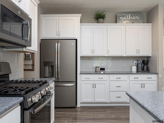 15218 Vane St, Bennington, NE 68007 - kitchen with stainless steel appliances, backsplash, dark wood-type flooring, white cabinets, and light stone counters
