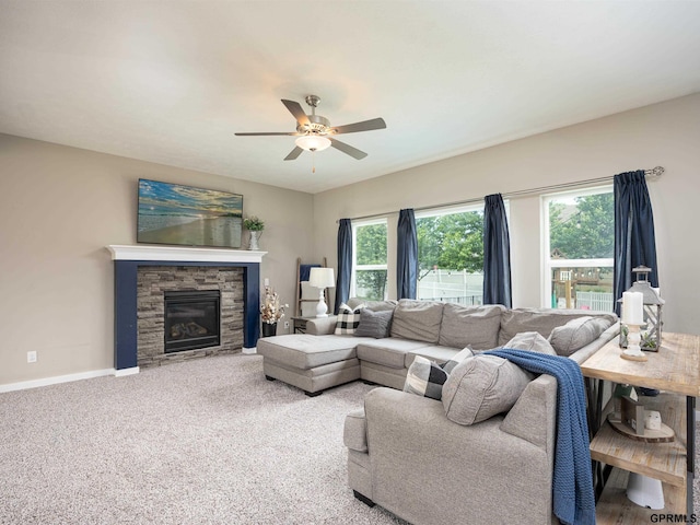 15218 Vane St, Bennington, NE 68007 - carpeted living area featuring ceiling fan and a stone fireplace