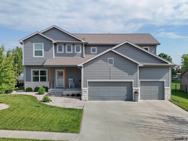 15218 Vane St, Bennington, NE 68007 - view of front facade with stone siding, driveway, a shingled roof, and covered porch