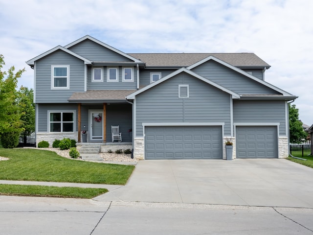 15218 Vane St, Bennington, NE 68007 - view of front of property with stone siding, driveway, a garage, and a porch