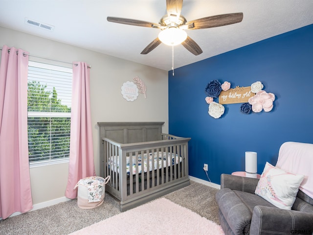 15218 Vane St, Bennington, NE 68007 - carpeted bedroom featuring a crib and ceiling fan