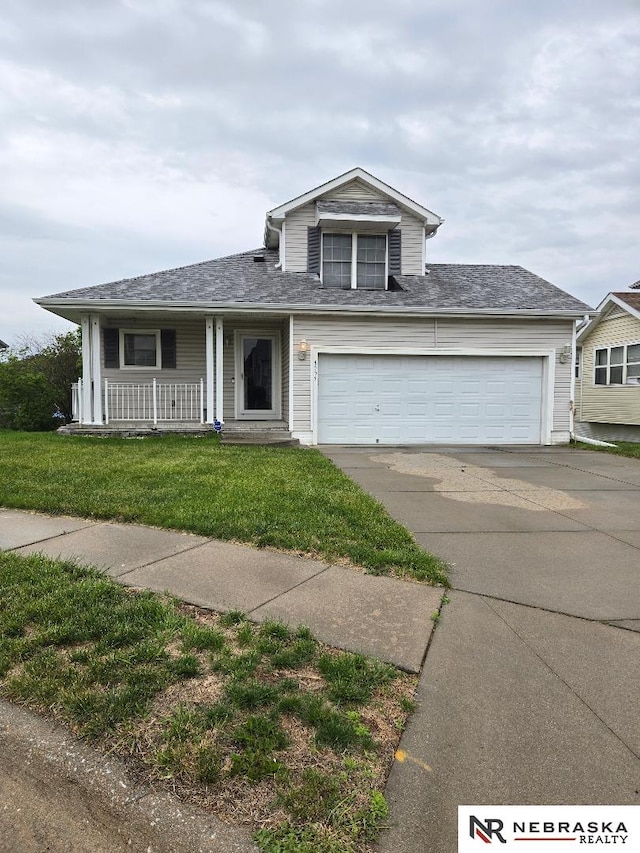 4555 Meredith Ave, Omaha, NE 68104 - traditional-style house with concrete driveway, a front lawn, covered porch, and a garage