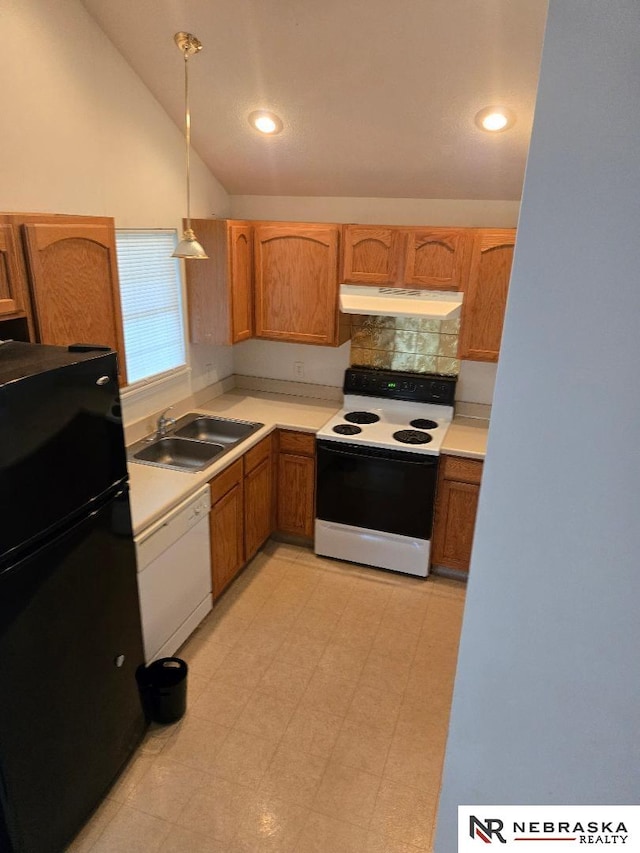 4555 Meredith Ave, Omaha, NE 68104 - kitchen featuring electric range oven, freestanding refrigerator, under cabinet range hood, white dishwasher, and a sink