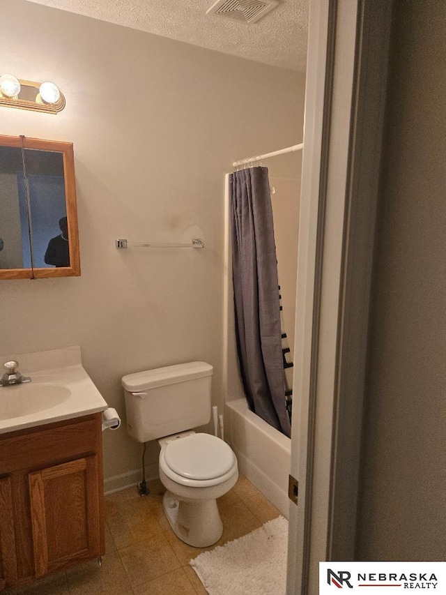 4555 Meredith Ave, Omaha, NE 68104 - bathroom featuring toilet, vanity, tile patterned flooring, a textured ceiling, and shower / tub combo