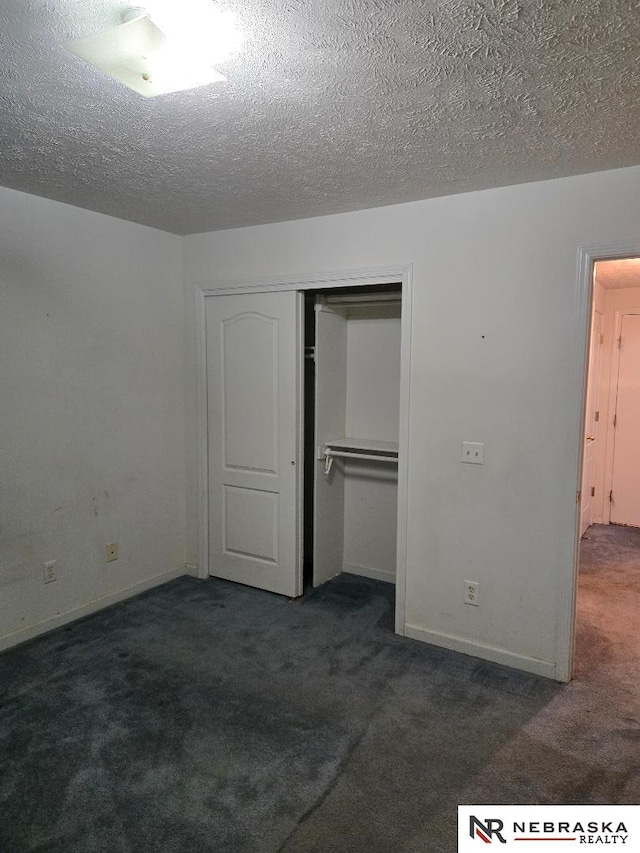 4555 Meredith Ave, Omaha, NE 68104 - unfurnished bedroom with carpet floors, a closet, a textured ceiling, and baseboards