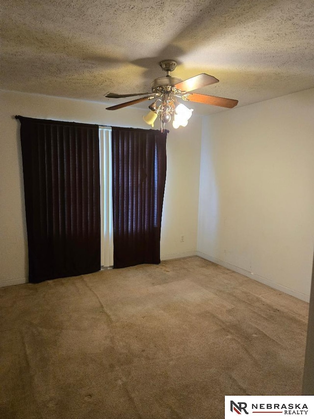 4555 Meredith Ave, Omaha, NE 68104 - spare room featuring light carpet, a ceiling fan, and a textured ceiling