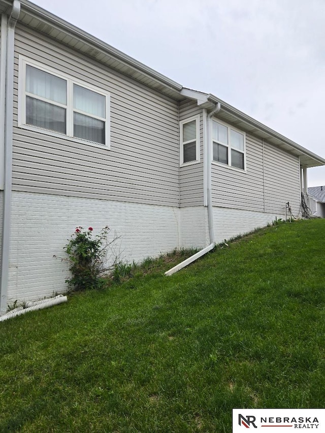 4555 Meredith Ave, Omaha, NE 68104 - view of property exterior with a yard