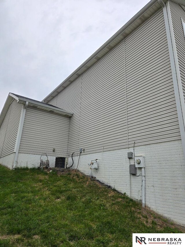 4555 Meredith Ave, Omaha, NE 68104 - view of home's exterior featuring a yard