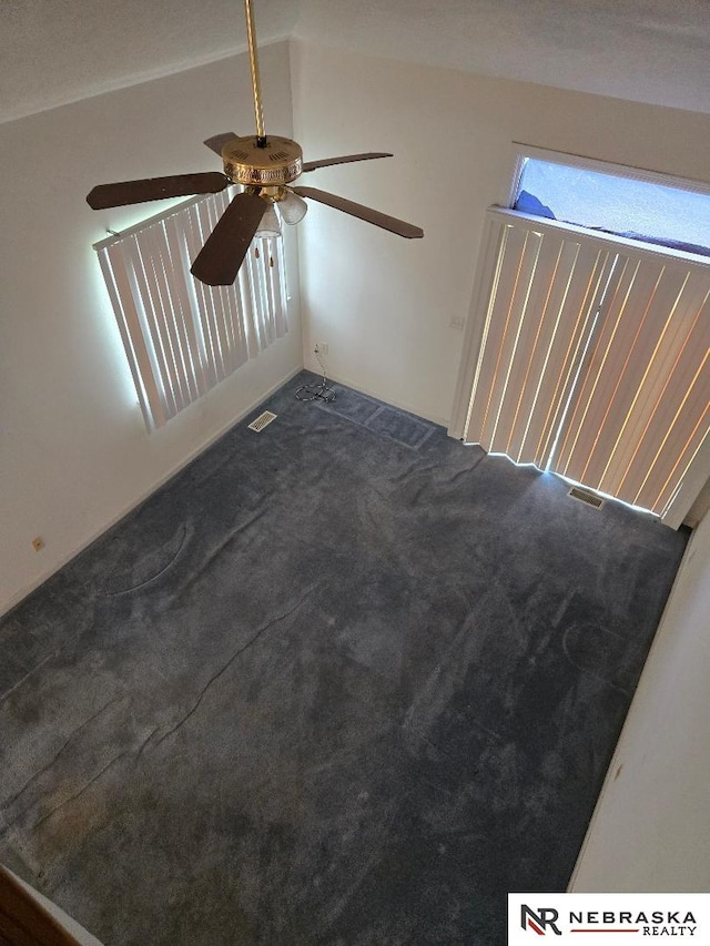 4555 Meredith Ave, Omaha, NE 68104 - empty room with a ceiling fan, carpet floors, and lofted ceiling