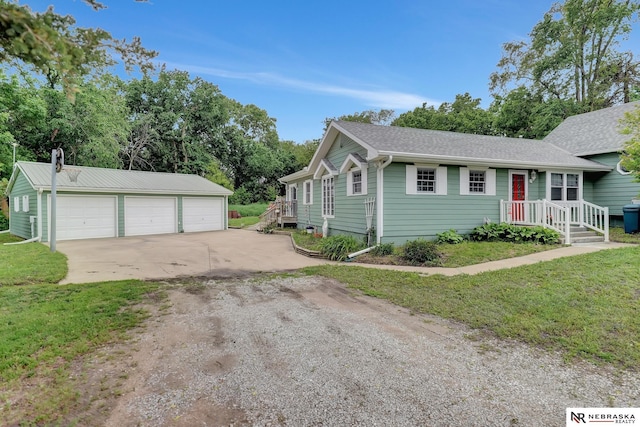 7105 W Davey Rd, Raymond, NE 68428 - view of front of property with an outdoor structure, a detached garage, and a front lawn