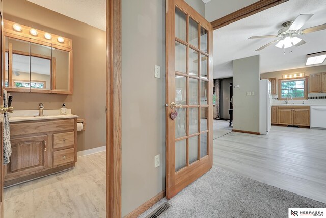 7105 W Davey Rd, Raymond, NE 68428 - bathroom with vanity, ceiling fan, wood finished floors, and baseboards