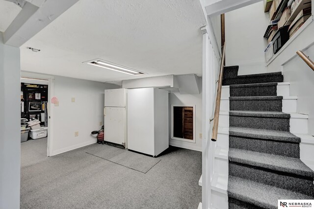 7105 W Davey Rd, Raymond, NE 68428 - stairway featuring baseboards and carpet