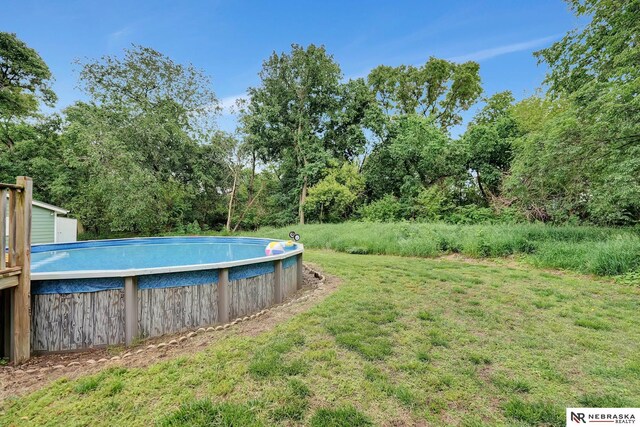 7105 W Davey Rd, Raymond, NE 68428 - view of green lawn featuring an outdoor pool