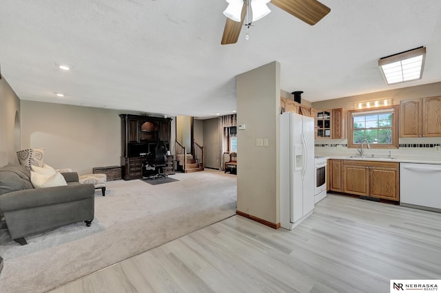 7105 W Davey Rd, Raymond, NE 68428 - living room with light wood finished floors, stairway, ceiling fan, and recessed lighting
