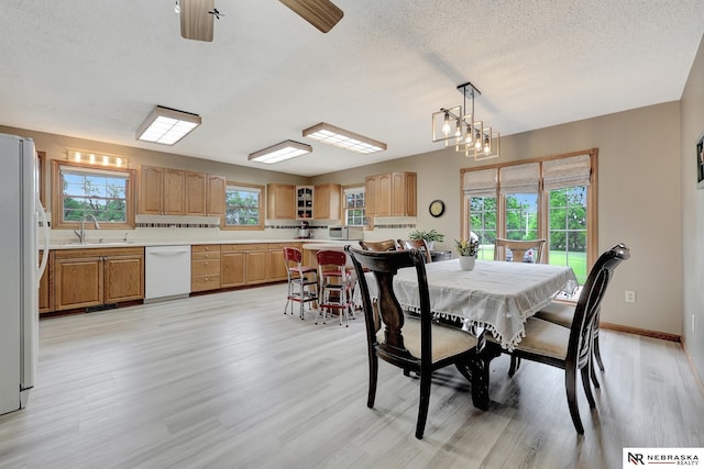 7105 W Davey Rd, Raymond, NE 68428 - dining area featuring light wood-style flooring, a textured ceiling, baseboards, and ceiling fan