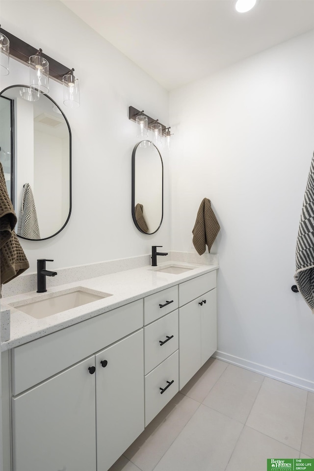 5320 Elmwood Plz, Omaha, NE 68106 - full bathroom featuring double vanity, tile patterned floors, and baseboards