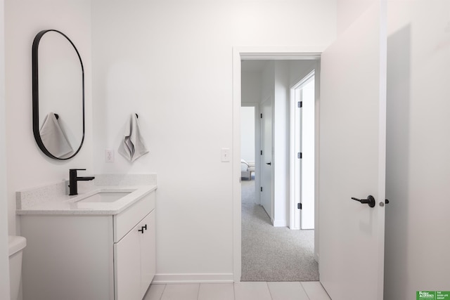 5320 Elmwood Plz, Omaha, NE 68106 - bathroom with vanity, toilet, baseboards, and tile patterned flooring