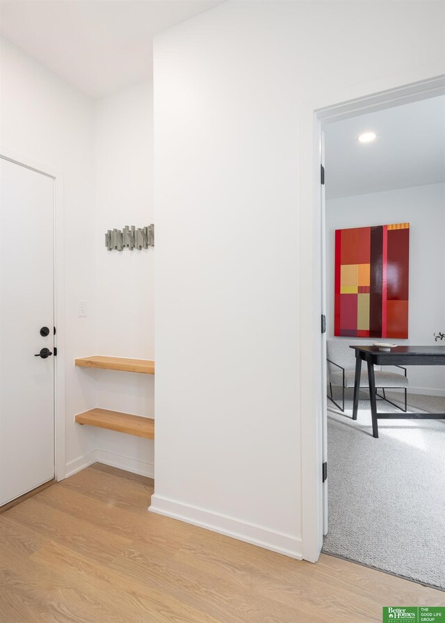 5320 Elmwood Plz, Omaha, NE 68106 - hall with light wood finished floors and baseboards