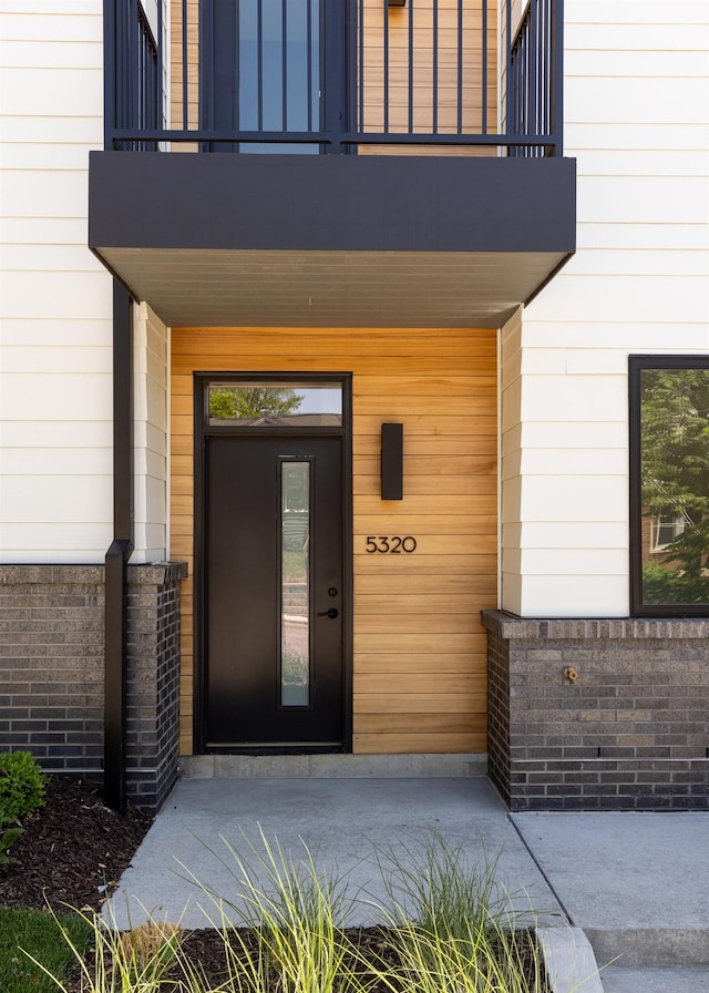 5320 Elmwood Plz, Omaha, NE 68106 - doorway to property with a balcony and covered porch