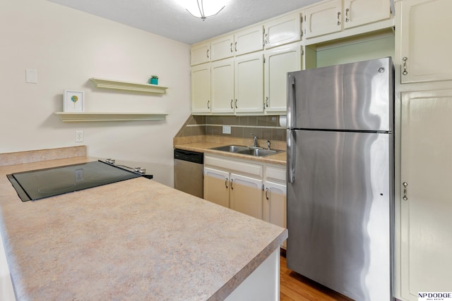 12726 Gail Plz Unit 107, Omaha, NE 68137 - kitchen with appliances with stainless steel finishes, a sink, decorative backsplash, open shelves, and light countertops