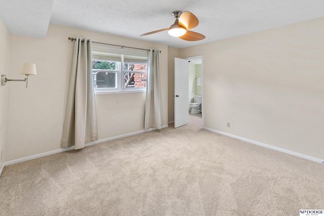 12726 Gail Plz Unit 107, Omaha, NE 68137 - unfurnished bedroom with carpet flooring, baseboards, a ceiling fan, and ensuite bathroom