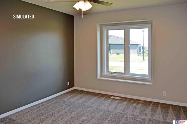 512 Deep Water Bay, Lincoln, NE 68527 - empty room featuring a ceiling fan, baseboards, and dark colored carpet