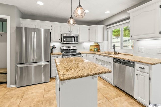 17310 I St, Omaha, NE 68135 - kitchen featuring appliances with stainless steel finishes, a sink, white cabinets, a center island, and recessed lighting