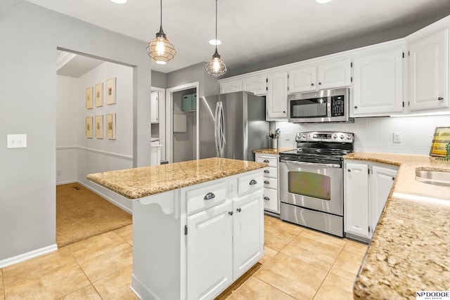 17310 I St, Omaha, NE 68135 - kitchen featuring stainless steel appliances, a kitchen island, white cabinetry, and light tile patterned flooring