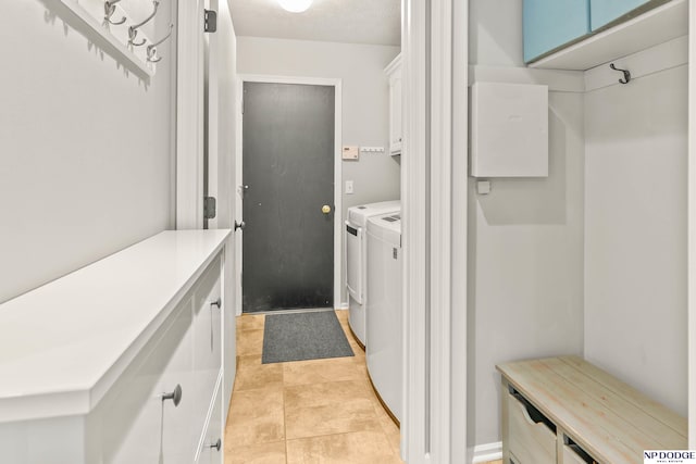 17310 I St, Omaha, NE 68135 - washroom with cabinet space, separate washer and dryer, and light tile patterned flooring
