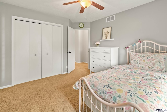 17310 I St, Omaha, NE 68135 - carpeted bedroom featuring a closet, baseboards, and a ceiling fan