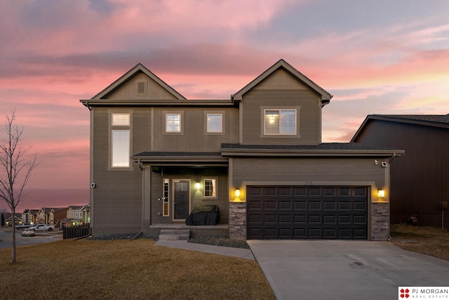 7775 N 149th St, Bennington, NE 68007 - view of front of home with concrete driveway, an attached garage, and a yard