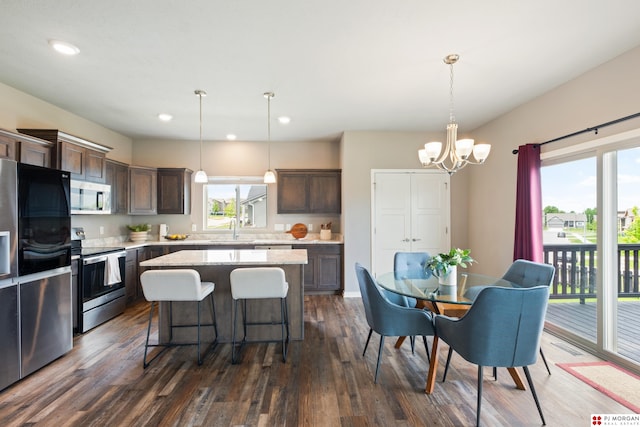 7775 N 149th St, Bennington, NE 68007 - kitchen featuring appliances with stainless steel finishes, plenty of natural light, dark brown cabinetry, and recessed lighting