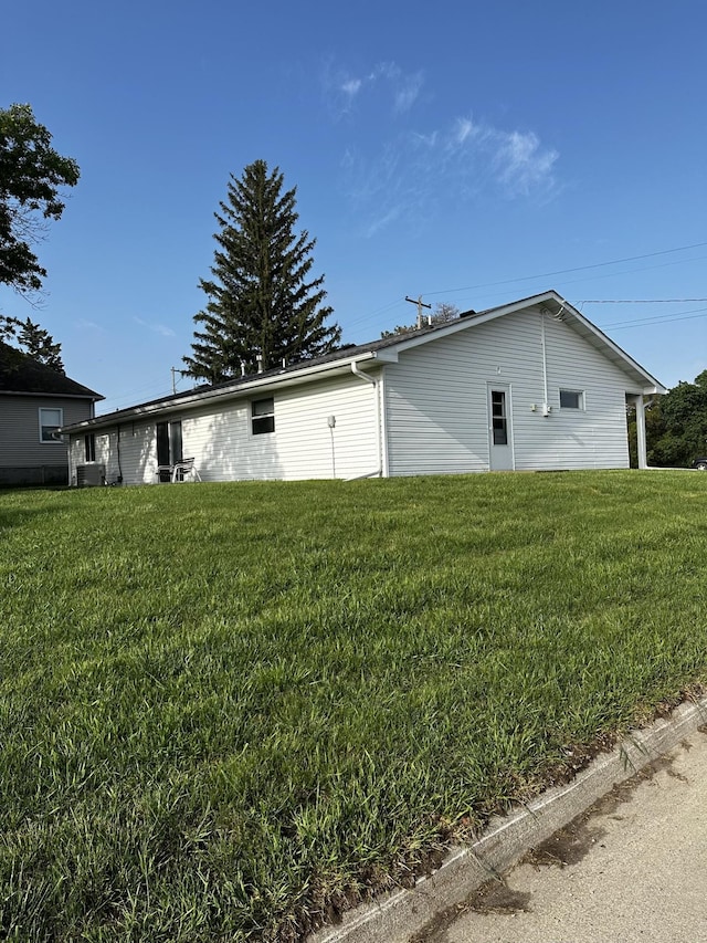 802 Main St, Bancroft, NE 68004 - view of property exterior featuring a yard