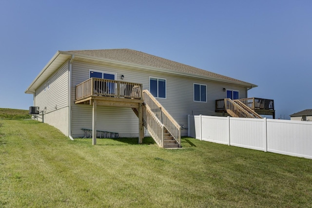 8105 S 177th St, Omaha, NE 68136 - back of property featuring stairs, a deck, a lawn, and central AC