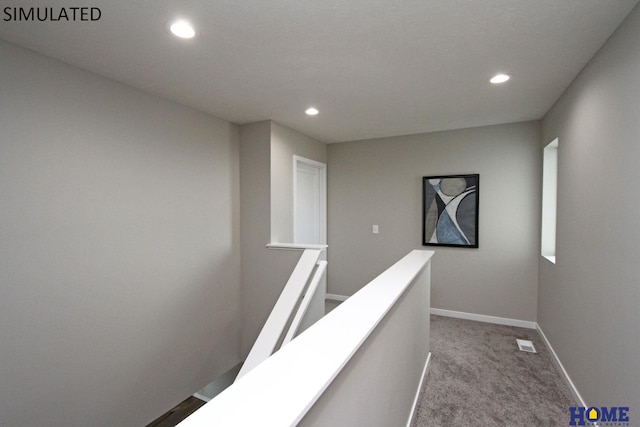 10709 Shore Front Dr, Lincoln, NE 68527 - hallway with an upstairs landing, recessed lighting, carpet, and baseboards