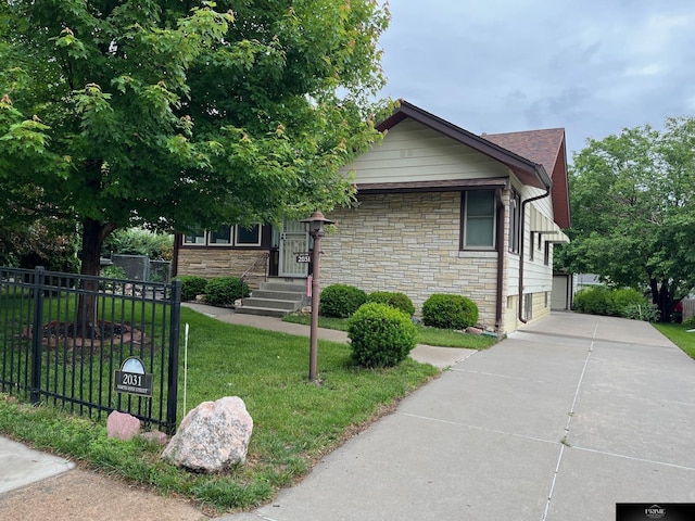2031 N 49th St, Omaha, NE 68104 - view of front of property with stone siding and a garage