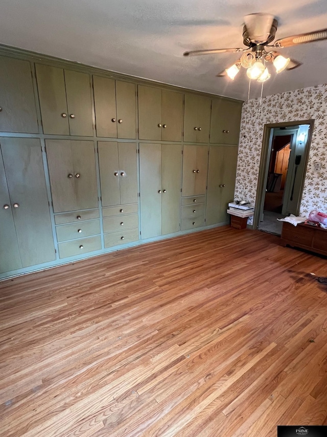 2031 N 49th St, Omaha, NE 68104 - spare room with light wood-style floors, a ceiling fan, and wallpapered walls