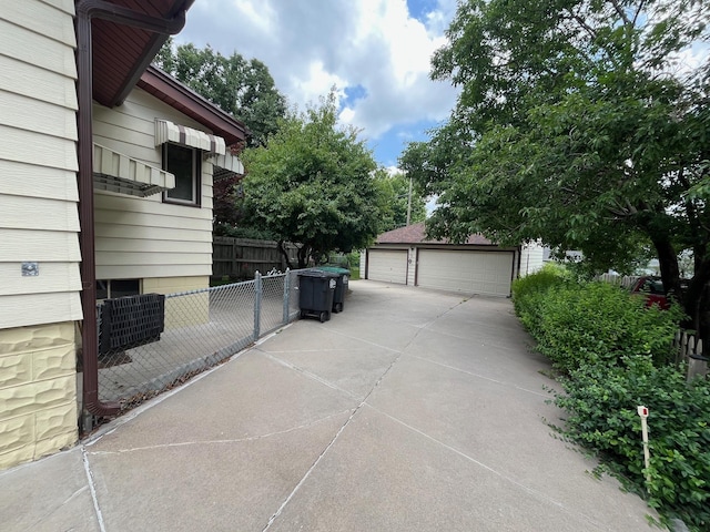 2031 N 49th St, Omaha, NE 68104 - view of side of property featuring a garage and an outbuilding