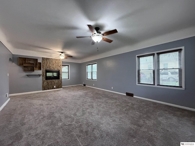 3836 Drexel St, Omaha, NE 68107 - unfurnished living room featuring ceiling fan, baseboards, a large fireplace, and carpet