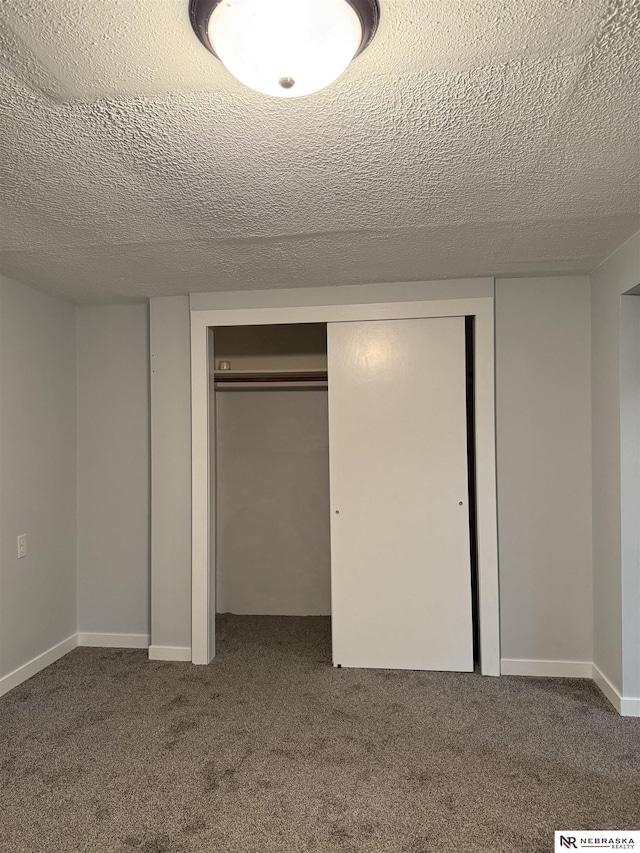3836 Drexel St, Omaha, NE 68107 - unfurnished bedroom with carpet, a closet, and a textured ceiling
