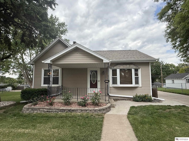 3836 Drexel St, Omaha, NE 68107 - bungalow-style house featuring covered porch and a shingled roof
