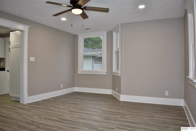 116 8th St, Scribner, NE 68057 - unfurnished room with a ceiling fan, recessed lighting, wood finished floors, and baseboards